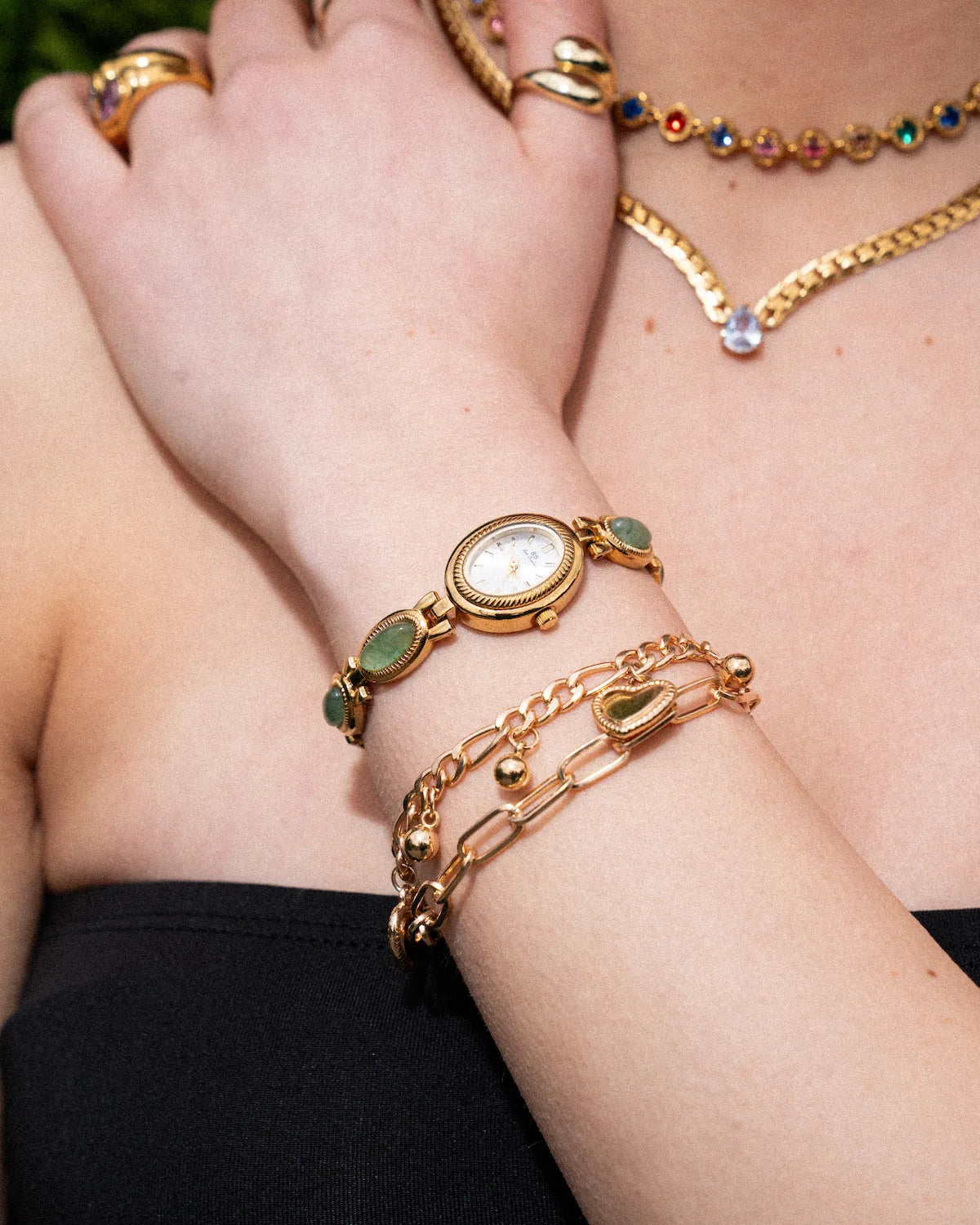 Elegant Gold-Colored Women's Watch with Decorative Stone Accents