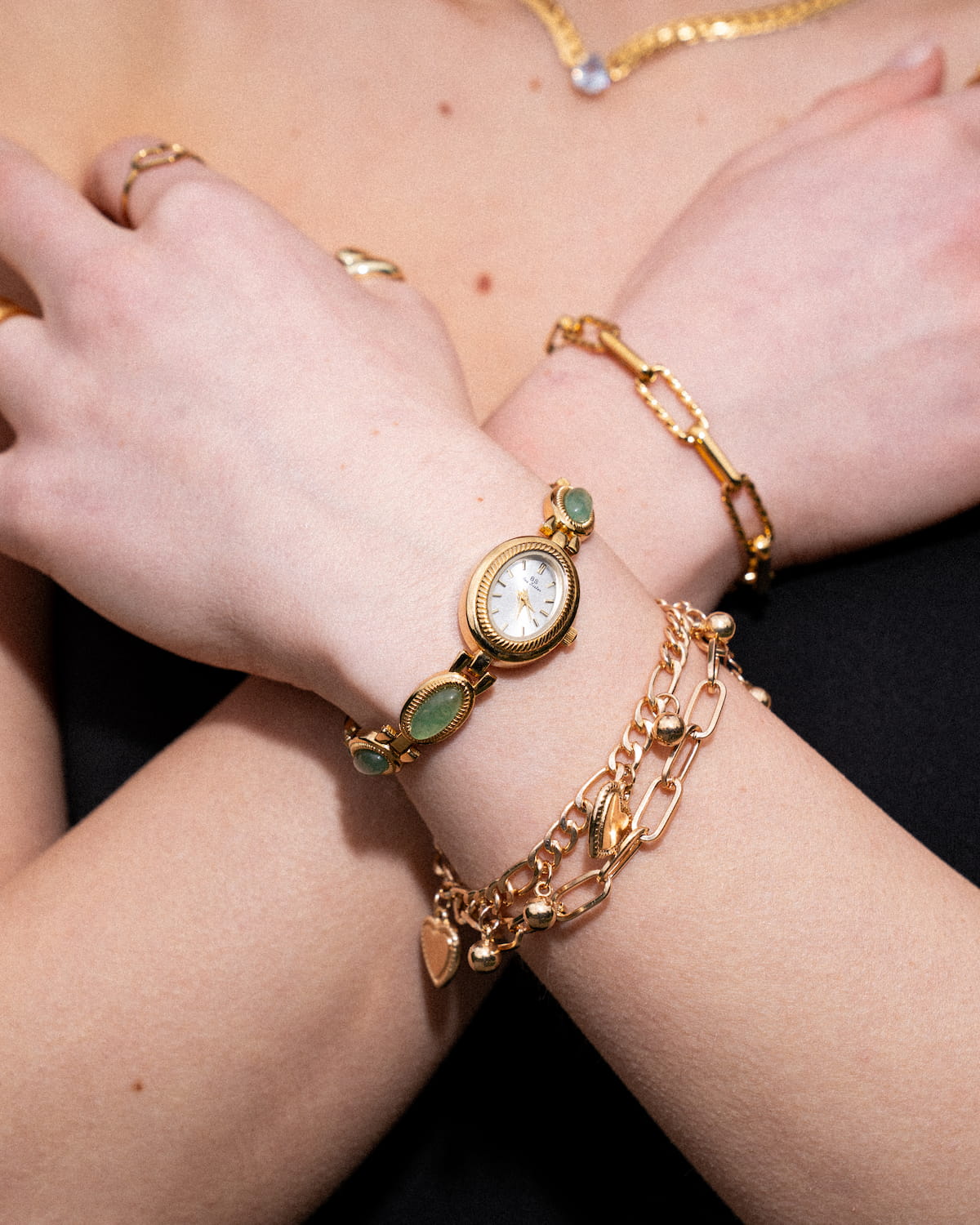 Elegant Gold-Colored Women's Watch with Decorative Stone Accents